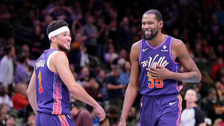 Nov 21, 2023; Phoenix, Arizona, USA; Phoenix Suns guard Devin Booker (1) and Phoenix Suns forward