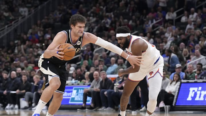 Milwaukee Bucks center Brook Lopez (11) drives to the basket against New York Knicks center Mitchell Robinson (23)