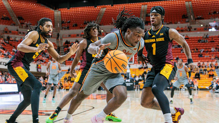 Feb 9, 2025; Stillwater, Oklahoma, USA;  Oklahoma State Cowboys guard Jamyron Keller (14) drives the baseline during the first half against the Arizona State Sun Devils at Gallagher-Iba Arena. Mandatory Credit: William Purnell-Imagn Images