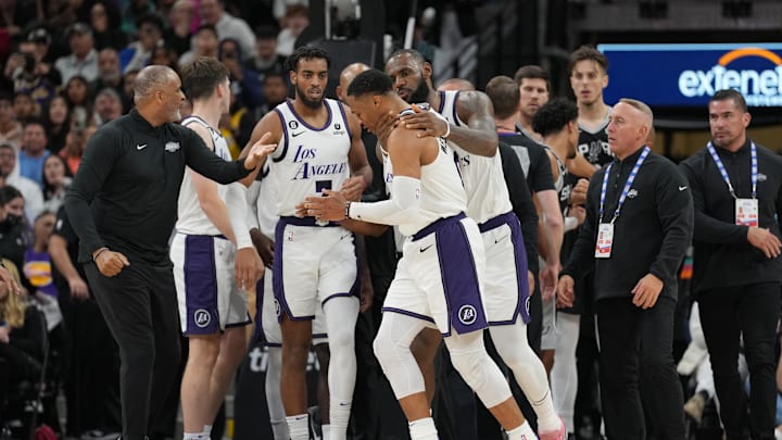 Nov 26, 2022; San Antonio, Texas, USA;  Los Angeles Lakers forward LeBron James (6) holds guard Russell Westbrook (0) after Westbrook was fouled by San Antonio Spurs forward Zach Collins (23) in the second half at the AT&T Center. Mandatory Credit: Daniel Dunn-Imagn Images