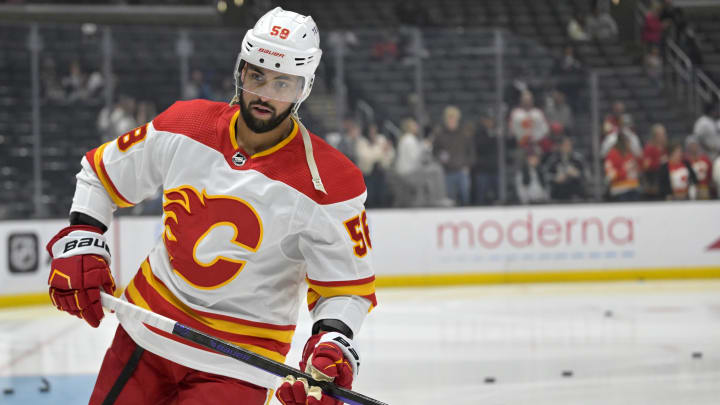 Apr 11, 2024; Los Angeles, California, USA;  Calgary Flames defenseman Oliver Kylington (58) warms up prior to the game against the Los Angeles Kings at Crypto.com Arena. Mandatory Credit: Jayne Kamin-Oncea-USA TODAY Sports