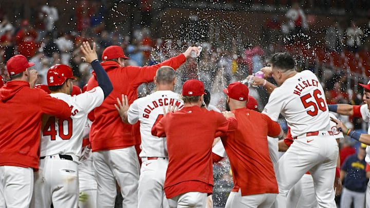 Aug 21, 2024; St. Louis, Missouri, USA;  St. Louis Cardinals third baseman Nolan Arenado (28) celebrates with teammates after hitting a walk-off grand slam against the Milwaukee Brewers during the tenth inning at Busch Stadium. Mandatory Credit: Jeff Curry-Imagn Images