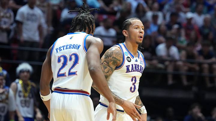 Mar 20, 2026; San Diego, CA, USA; Kansas Jayhawks guard Tre White (3) and guard Darryn Peterson (22) react in the first half against the California Baptist Lancers during a first round game of the men's 2026 NCAA Tournament at Viejas Arena. Mandatory Credit: Kirby Lee-Imagn Images Mar 20, 2026; San Diego, CA, USA; Kansas Jayhawks guard Tre White (3) and guard Darryn Peterson (22) react in the first half against the California Baptist Lancers during a first round game of the men's 2026 NCAA Tournament at Viejas Arena. Mandatory Credit: Kirby Lee-Imagn Images