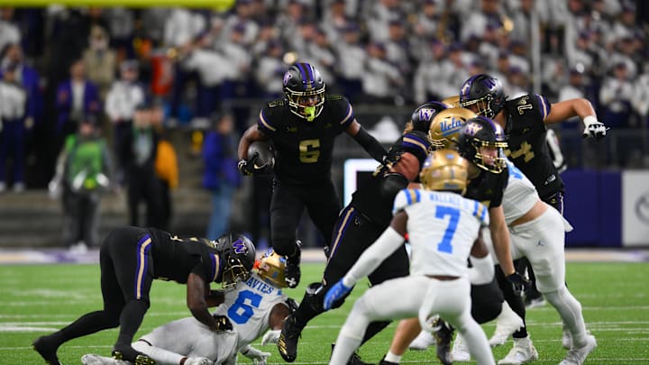 Nov 15, 2024; Seattle, Washington, USA; Washington Huskies wide receiver Jeremiah Hunter (6) carries the ball after a catch against the UCLA Bruins during the first half at Alaska Airlines Field at Husky Stadium. Mandatory Credit: Steven Bisig-Imagn Images