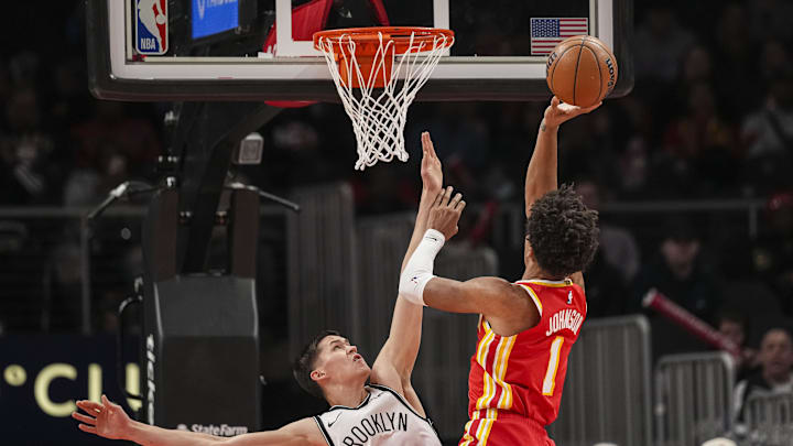 Feb 22, 2026; Atlanta, Georgia, USA; Brooklyn Nets guard Egor Demin (8) defends against Atlanta Hawks forward Jalen Johnson (1) during the first half at State Farm Arena. Mandatory Credit: Dale Zanine-Imagn Images