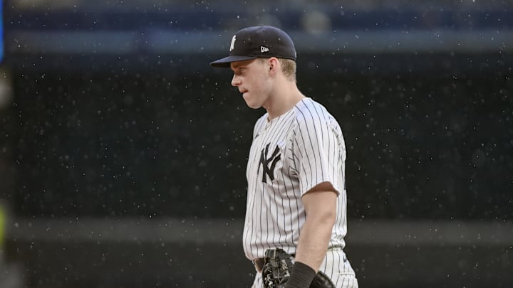 Sep 6, 2025; Bronx, New York, USA; New York Yankees first baseman Ben Rice (22) looks on as a steady rain begins to fall during the sixth inning against the Toronto Blue Jays at Yankee Stadium. Mandatory Credit: John Jones-Imagn Images