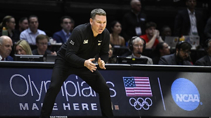 Mar 22, 2026; San Diego, CA, USA; Arizona Wildcats head coach Tommy Lloyd reacts in the first half against the Utah State Aggies during a second round game of the men's 2026 NCAA Tournament at Viejas Arena. Mandatory Credit: Denis Poroy-Imagn Images