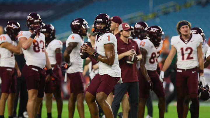 Sep 27, 2024; Miami Gardens, Florida, USA; Virginia Tech Hokies quarterback Kyron Drones (1) warms up before the game against the Miami Hurricanes at Hard Rock Stadium. Mandatory Credit: Sam Navarro-Imagn Images