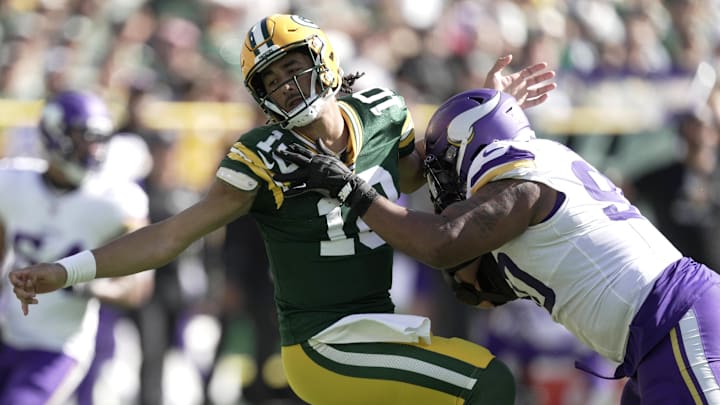 Sep 29, 2024; Green Bay, Wisconsin, USA; Minnesota Vikings defensive end Jonathan Bullard (90) pressures Green Bay Packers quarterback Jordan Love (10) during the third quarter of their game Sunday, September 29, 2024 at Lambeau Field in Green Bay, Wisconsin. Mandatory Credit: Mark Hoffman/USA TODAY Network via Imagn Images