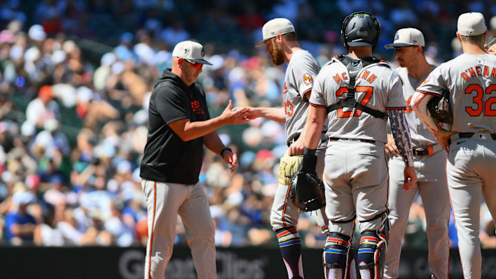Jul 4, 2024; Seattle, Washington, USA; Baltimore Orioles manager Brandon Hyde (18) pulls relief pitcher Bryan Baker (43) from the game during the seventh inning against the Seattle Mariners at T-Mobile Park.