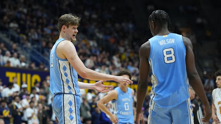 North Carolina Tar Heels center Henri Veesaar (left) talks with forward Caleb Wilson (8) 