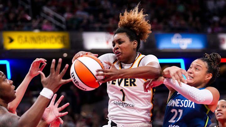 Indiana Fever forward NaLyssa Smith (1) rebounds the ball Friday, Sept. 6, 2024, during a game between the Indiana Fever and the Minnesota Lynx at Gainbride Fieldhouse in Indianapolis.