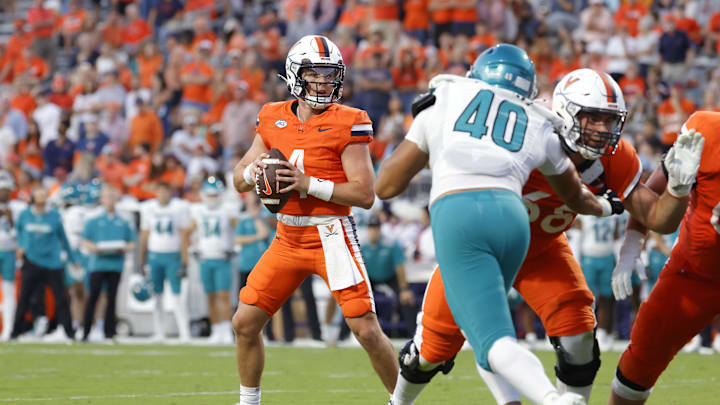 Aug 30, 2025; Charlottesville, Virginia, USA; Virginia Cavaliers quarterback Chandler Morris (4) prepares to throw the ball against the Coastal Carolina Chanticleers during the second quarter at Scott Stadium. Mandatory Credit: Amber Searls-Imagn Images Aug 30, 2025; Charlottesville, Virginia, USA; Virginia Cavaliers quarterback Chandler Morris (4) prepares to throw the ball against the Coastal Carolina Chanticleers during the second quarter at Scott Stadium. Mandatory Credit: Amber Searls-Imagn Images