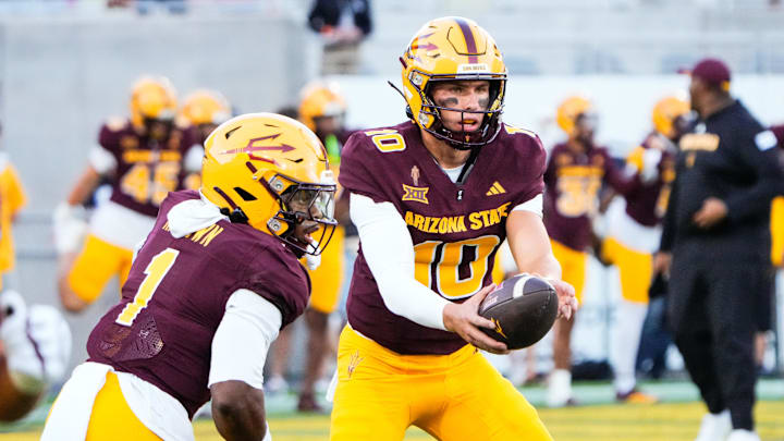 Aug 30, 2025; Tempe, Arizona, USA; Arizona State Sun Devils quarterback Sam Leavitt (10) hands off the ball to Arizona State Sun Devils running back Kyson Brown (1) during warm ups before the game against the Northern Arizona Lumberjacks at Mountain America Stadium. Mandatory Credit: Arianna Grainey-Imagn Images