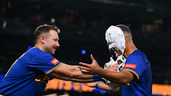 Sep 11, 2025; Seattle, Washington, USA; Seattle Mariners catcher Cal Raleigh (29) smears shaving cream on pinch hitter Harry Ford (5) after the Mariners defeated the Los Angeles Angels at T-Mobile Park. Mandatory Credit: Steven Bisig-Imagn Images Sep 11, 2025; Seattle, Washington, USA; Seattle Mariners catcher Cal Raleigh (29) smears shaving cream on pinch hitter Harry Ford (5) after the Mariners defeated the Los Angeles Angels at T-Mobile Park. Mandatory Credit: Steven Bisig-Imagn Images