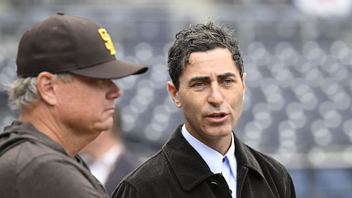 Mar 27, 2025; San Diego, California, USA; San Diego Padres general manager A.J. Preller, right, talks with manager Mike Shildt before an Opening Day baseball game between the San Diego Padres and the Atlanta Braves at Petco Park. Mandatory Credit: Denis Poroy-Imagn Images
