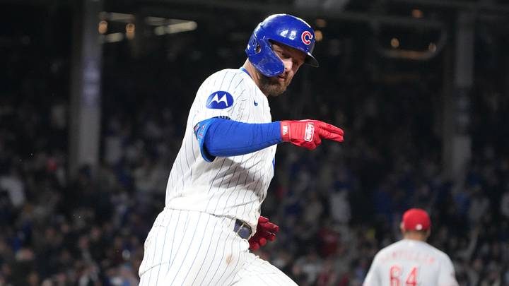 Michael Busch and the Cubs are home favorites against the Reds.