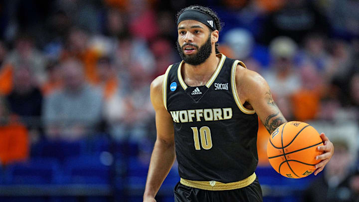 Mar 20, 2025; Lexington, KY, USA; Wofford Terriers guard Corey Tripp (10) brings the ball up court during the first half against the Tennessee Volunteers in the first round of the NCAA Tournament at Rupp Arena. Mandatory Credit: Aaron Doster-Imagn Images