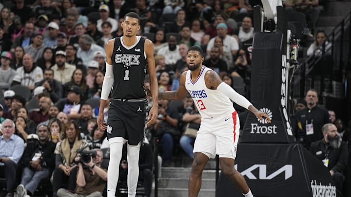 Nov 22, 2023; San Antonio, Texas, USA; Los Angeles Clippers forward Paul George (13) defends San Antonio Spurs forward Victor Wembanyama (1) during the first half at Frost Bank Center. Mandatory Credit: Scott Wachter-USA TODAY Sports