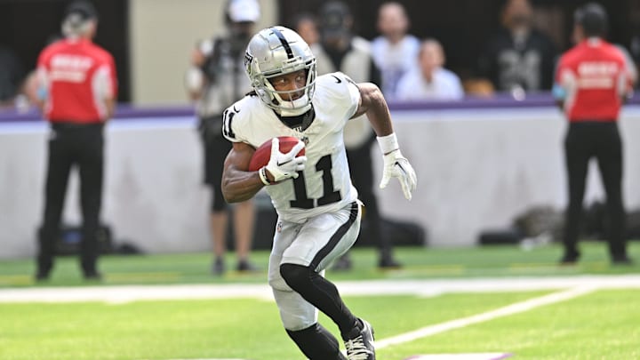 Aug 10, 2024; Minneapolis, Minnesota, USA; Las Vegas Raiders wide receiver Tre Tucker (11) returns a kickoff against the Minnesota Vikings during the second quarter at U.S. Bank Stadium. Mandatory Credit: Jeffrey Becker-Imagn Images