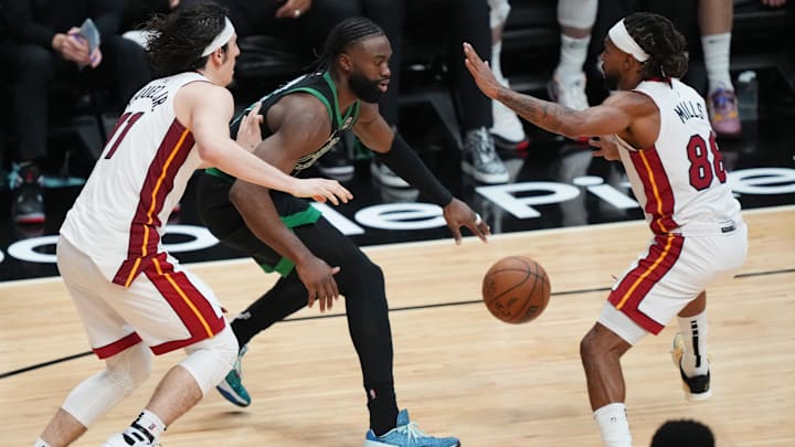 Apr 27, 2024; Miami, Florida, USA; Miami Heat guard Patty Mills (88) and guard Jaime Jaquez Jr. (11) defend Celtics forward Jaylen Brown - Jim Rassol/USA TODAY Sports