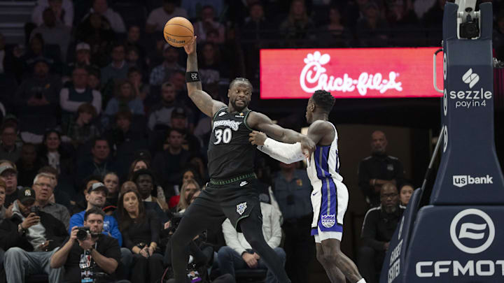 Dec 14, 2025; Minneapolis, Minnesota, USA; Minnesota Timberwolves forward Julius Randle (30) holds the ball up as Sacramento Kings guard Dennis Schroder (17) plays defense in the second half at Target Center. Mandatory Credit: Jesse Johnson-Imagn Images Dec 14, 2025; Minneapolis, Minnesota, USA; Minnesota Timberwolves forward Julius Randle (30) holds the ball up as Sacramento Kings guard Dennis Schroder (17) plays defense in the second half at Target Center. Mandatory Credit: Jesse Johnson-Imagn Images
