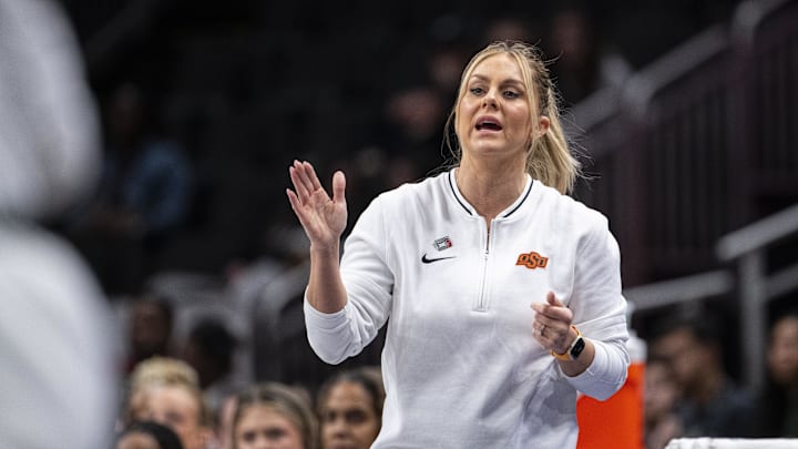 Mar 7, 2025; Kansas City, MO, USA; Oklahoma State Cowgirls head coach Jacie Hoyt looks on from the sideline during the first half against the Texas Tech Lady Raiders at T-Mobile Center. Mandatory Credit: Amy Kontras-Imagn Images Mar 7, 2025; Kansas City, MO, USA; Oklahoma State Cowgirls head coach Jacie Hoyt looks on from the sideline during the first half against the Texas Tech Lady Raiders at T-Mobile Center. Mandatory Credit: Amy Kontras-Imagn Images