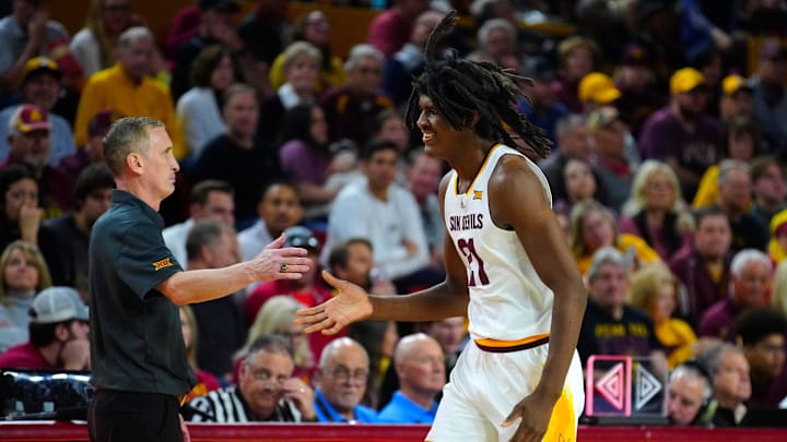 ASU head coach Bobby Hurley high-fives center Jayden Quaintance (21) as he comes to the bench during a game at Desert Financial Arena in Tempe on Jan. 25, 2025.