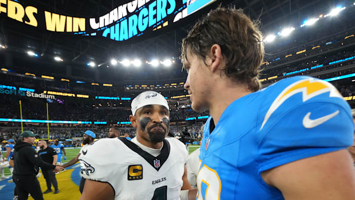 Dec 8, 2025; Inglewood, California, USA; Los Angeles Chargers quarterback Justin Herbert (10) embraces Philadelphia Eagles quarterback Jalen Hurts (1) after the game at SoFi Stadium. Mandatory Credit: Kirby Lee-Imagn Images Dec 8, 2025; Inglewood, California, USA; Los Angeles Chargers quarterback Justin Herbert (10) embraces Philadelphia Eagles quarterback Jalen Hurts (1) after the game at SoFi Stadium. Mandatory Credit: Kirby Lee-Imagn Images