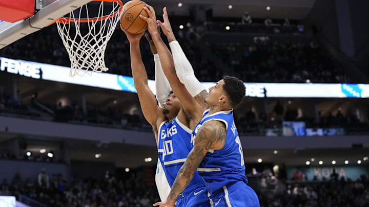 Feb 23, 2025; Milwaukee, Wisconsin, USA;  Milwaukee Bucks center Jericho Sims (00) grabs a rebound during the fourth quarter against the Miami Heat at Fiserv Forum. Mandatory Credit: Jeff Hanisch-Imagn Images