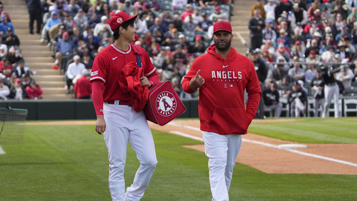 Feb 26, 2023; Tempe, Arizona, USA; Los Angeles Angels starting pitcher Shohei Ohtani (17) and Albert Pujols left the game together in the fourth inning against the Chicago White Sox at Tempe Diablo Stadium. Mandatory Credit: Rick Scuteri-Imagn Images