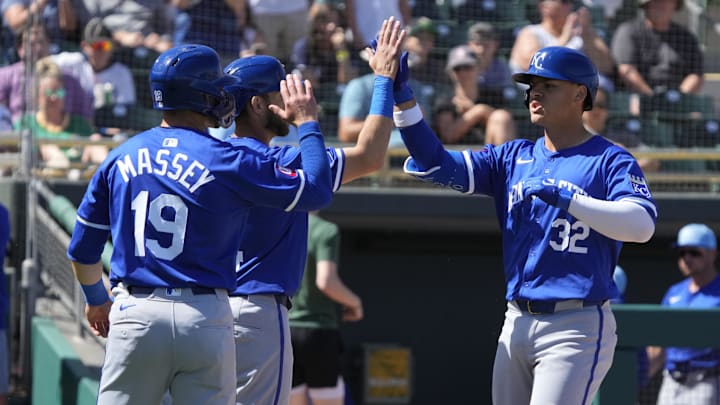 Mar 10, 2024; Mesa, Arizona, USA; Kansas City Royals first baseman Nick Pratto (32) celebrates with catcher Austin Nola (14), and second baseman Michael Massey (19) after hitting a three run home run against the Oakland Athletics in the second inning at Hohokam Stadium. Mandatory Credit: Rick Scuteri-Imagn Images Mar 10, 2024; Mesa, Arizona, USA; Kansas City Royals first baseman Nick Pratto (32) celebrates with catcher Austin Nola (14), and second baseman Michael Massey (19) after hitting a three run home run against the Oakland Athletics in the second inning at Hohokam Stadium. Mandatory Credit: Rick Scuteri-Imagn Images