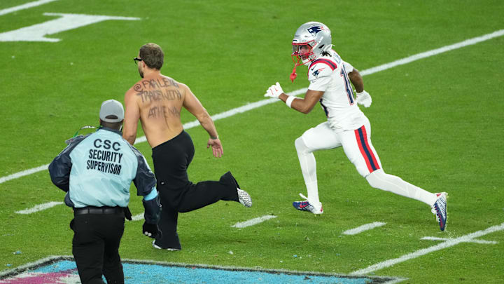 Williams (right), a wide receiver for the Patriots, found himself playing defense in Super Bowl LX. 