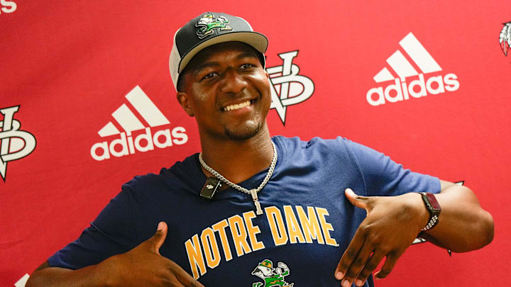 Vero Beach quarterback Wonderful “Champ” Monds IV, a four-star recruit, announces his college decision to attend University of Notre Dame live on the Pat McAfee Show on ESPN, May 1, 2026, at Vero Beach High School along surrounded by family members, teammates and coach Lenny Jankowski. Monds is rated the No. 2 quarterback in Florida and the No. 22 overall recruit in the state on the USA TODAY Florida Network Top 100.
