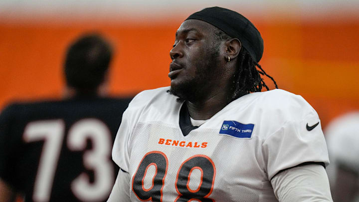 Cincinnati Bengals defensive tackle T.J. Slaton (98) wraps up before a preseason training camp practice in downtown Cincinnati on Thursday, July 31, 2025. Cincinnati Bengals defensive tackle T.J. Slaton (98) wraps up before a preseason training camp practice in downtown Cincinnati on Thursday, July 31, 2025.
