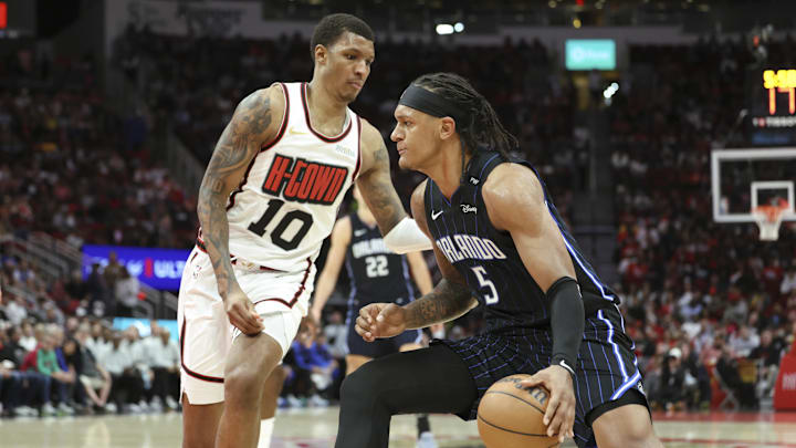 Mar 10, 2025; Houston, Texas, USA; Orlando Magic forward Paolo Banchero (5) drives with the ball as Houston Rockets forward Jabari Smith Jr. (10) defends during the third quarter at Toyota Center. Mandatory Credit: Troy Taormina-Imagn Images Mar 10, 2025; Houston, Texas, USA; Orlando Magic forward Paolo Banchero (5) drives with the ball as Houston Rockets forward Jabari Smith Jr. (10) defends during the third quarter at Toyota Center. Mandatory Credit: Troy Taormina-Imagn Images