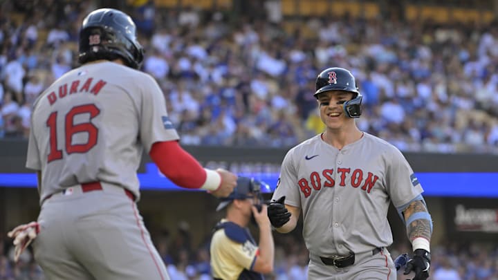 Boston Red Sox left fielder Tyler O'Neill (17) celebrates with left fielder Jarren Duran.