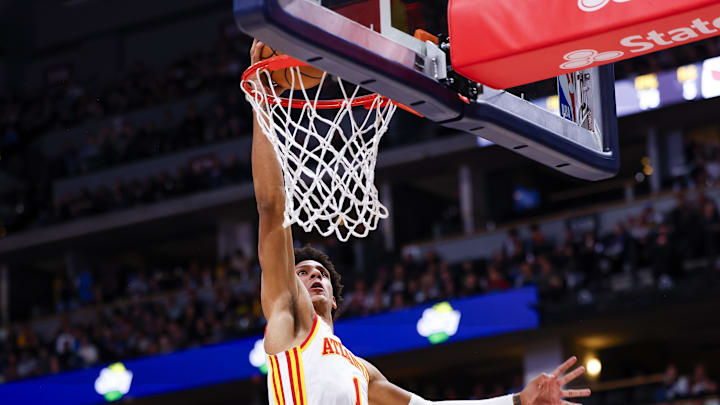 Apr 6, 2024; Denver, Colorado, USA; Atlanta Hawks forward Jalen Johnson (1) dunks the ball against the Denver Nuggets in the second half at Ball Arena. Mandatory Credit: Michael Ciaglo-Imagn Images