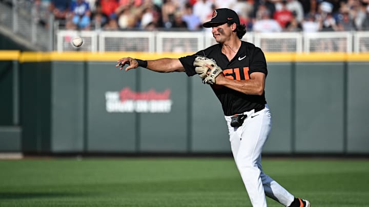 Jun 13, 2025; Omaha, Neb, USA; Oregon State Beavers second baseman AJ Singer (7) throws to first base against the Louisville Cardinals during the second inning at Charles Schwab Field. Mandatory Credit: Steven Branscombe-Imagn Images