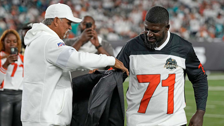 Former Bengals tackle Anthony Mu oz puts the Ring of Honor jacket on new inductee Willie Anderson during a halftime ceremony at the NFL Week 4 game between the Cincinnati Bengals and the Miami Dolphins at PayCor Stadium in downtown on Thursday, Sept. 29, 2022. The Bengals 14-12 at halftime.
Miami Dolphins At Cincinnati Bengals Week 4 Former Bengals tackle Anthony Mu oz puts the Ring of Honor jacket on new inductee Willie Anderson during a halftime ceremony at the NFL Week 4 game between the Cincinnati Bengals and the Miami Dolphins at PayCor Stadium in downtown on Thursday, Sept. 29, 2022. The Bengals 14-12 at halftime.
Miami Dolphins At Cincinnati Bengals Week 4