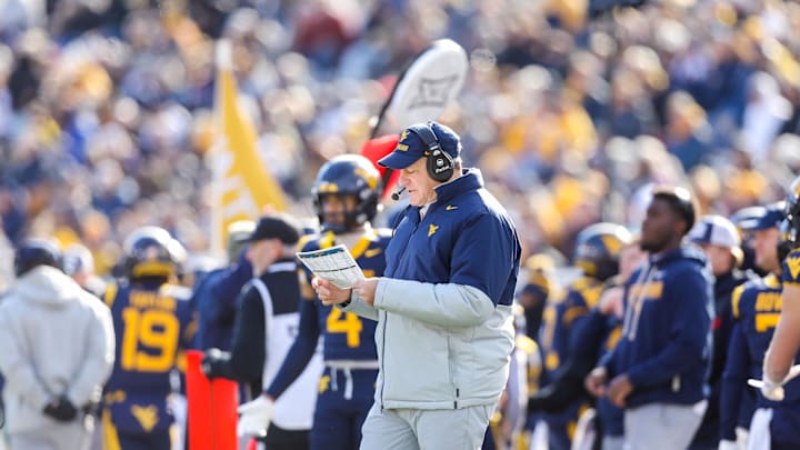 Nov 29, 2025; Morgantown, West Virginia, USA; West Virginia Mountaineers head coach Rich Rodriguez along the sidelines during the first quarter against the Texas Tech Red Raiders at Milan Puskar Stadium. Mandatory Credit: Ben Queen-Imagn Images
