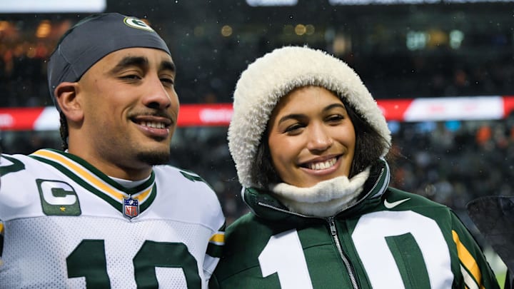 Jan 10, 2026; Chicago, IL, USA; Green Bay Packers quarterback Jordan Love (10) with his wife Monika Stone Love on the field prior to an NFC Wild Card Round game against the Chicago Bears at Soldier Field.