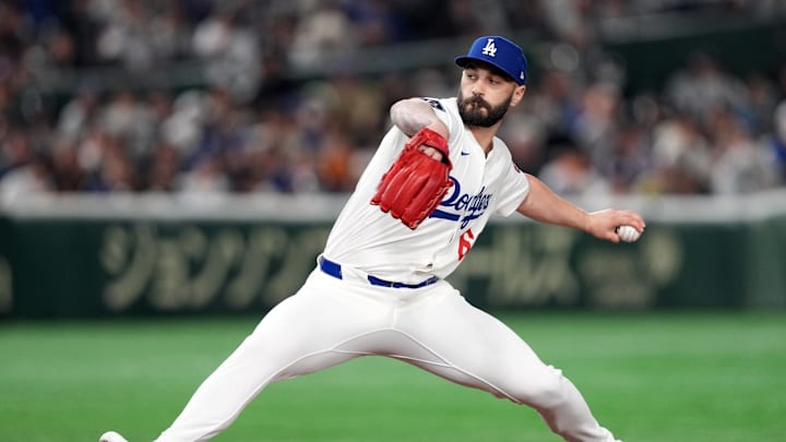 Los Angeles Dodgers pitcher Tanner Scott (66) throws a pitch against the Yomiuri Giants during the eighth inning at Tokyo Dome. Los Angeles Dodgers pitcher Tanner Scott (66) throws a pitch against the Yomiuri Giants during the eighth inning at Tokyo Dome.