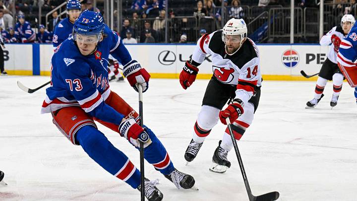 Oct 2, 2025; New York, New York, USA; New York Rangers center Matt Rempe (73) and New Jersey Devils forward Luke Glendening (14) play for the puck during the first period at Madison Square Garden. Mandatory Credit: Dennis Schneidler-Imagn Images Oct 2, 2025; New York, New York, USA; New York Rangers center Matt Rempe (73) and New Jersey Devils forward Luke Glendening (14) play for the puck during the first period at Madison Square Garden. Mandatory Credit: Dennis Schneidler-Imagn Images