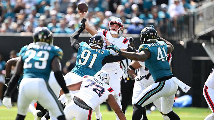 Sep 27, 2026; Jacksonville, Florida, USA; New England Patriots quarterback Drake Maye (10) throws downfield under pressure from Jacksonville Jaguars defensive tackle Arik Armstead (91) and defensive end Josh Hines-Allen (41) during the second quarter at EverBank Stadium. Mandatory Credit: Melina Myers-Imagn Images Sep 27, 2026; Jacksonville, Florida, USA; New England Patriots quarterback Drake Maye (10) throws downfield under pressure from Jacksonville Jaguars defensive tackle Arik Armstead (91) and defensive end Josh Hines-Allen (41) during the second quarter at EverBank Stadium. Mandatory Credit: Melina Myers-Imagn Images