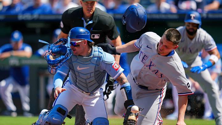 Jun 11, 2026; Kansas City, Missouri, USA; Texas Rangers shortstop Corey Seager (5) collides with Kansas City Royals catcher Carter Jensen (22) as he scores a run during the first inning at Kauffman Stadium. Mandatory Credit: Jay Biggerstaff-Imagn Images