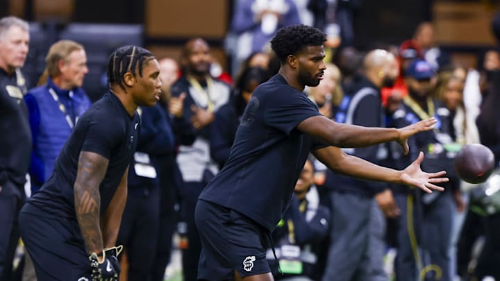 Apr 4, 2025; Boulder, CO, USA; Colorado Buffaloes quarterback Shedeur Sanders (2) takes a snap at the University of Colorado NFL Showcase at the CU Indoor Practice Facility. Mandatory Credit: Michael Ciaglo-Imagn Images