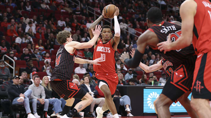 Jan 13, 2026; Houston, Texas, USA; Houston Rockets forward Jabari Smith Jr. (10) drives with the ball as Chicago Bulls forward Matas Buzelis (14) defends during the fourth quarter at Toyota Center. Mandatory Credit: Troy Taormina-Imagn Images