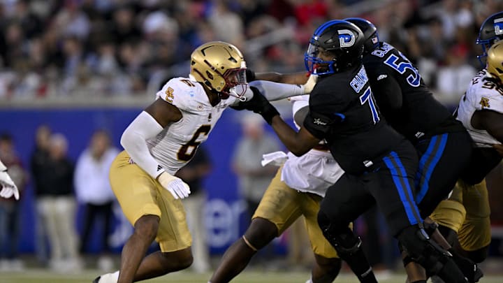 Nov 16, 2024; Dallas, Texas, USA; Boston College Eagles defensive end Donovan Ezeiruaku (6) and SMU Mustangs offensive lineman Andrew Chamblee (74) in action during the game between the SMU Mustangs and the Boston College Eagles at Gerald J. Ford Stadium. Mandatory Credit: Jerome Miron-Imagn Images