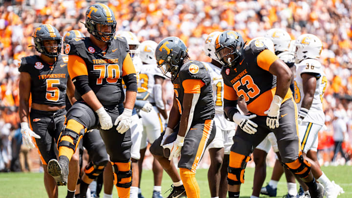 Tennessee offensive lineman Andrej Karic (70) and Tennessee offensive lineman Lance Heard (53) dance with Tennessee running back Dylan Sampson (6) after Sampson scored a touchdown during Tennessee's game against Chattanooga in Neyland Stadium in Knoxville on Saturday, Aug. 31, 2024.